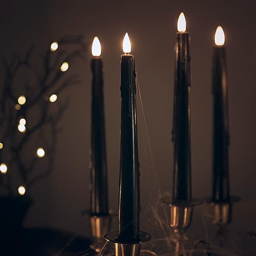 Lights4fun 4er Set TruGlow® LED schwarze Stabkerzen mit Fernbedienung Echtwachs Schwarz 24cm Halloweendeko