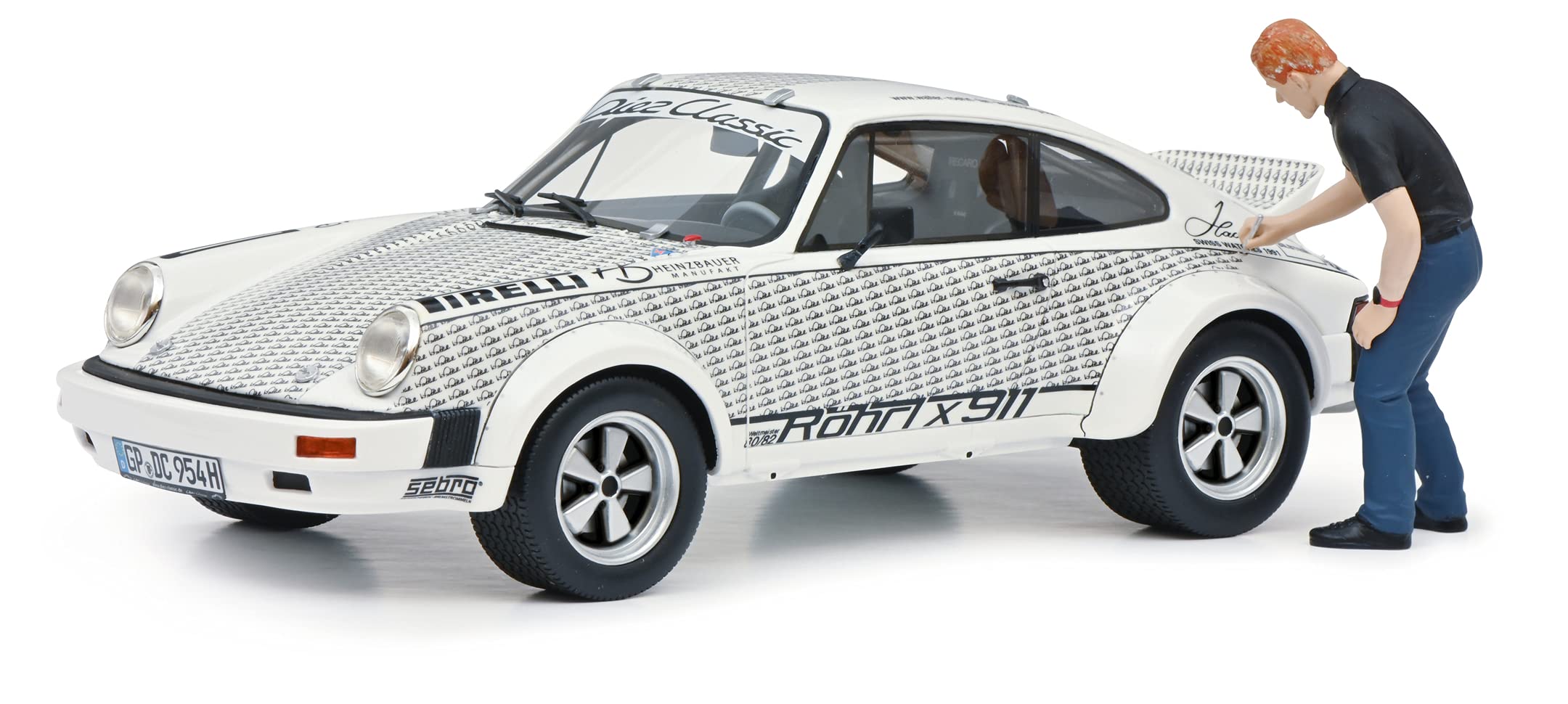 Schuco 450024900 Porsche Röhrl x911, mit Figur, Modellauto, Maßstab 1:18, Limited Edition 911, Resin, weiß, Mehrfarbig
