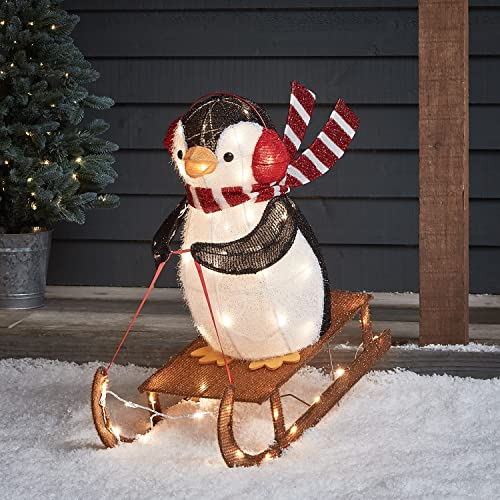Lights4fun 60er LED Pinguin schlittenfahrender Pinguin Weihnachtsbeleuchtung Außen Weihnachtsfigur mit Timer